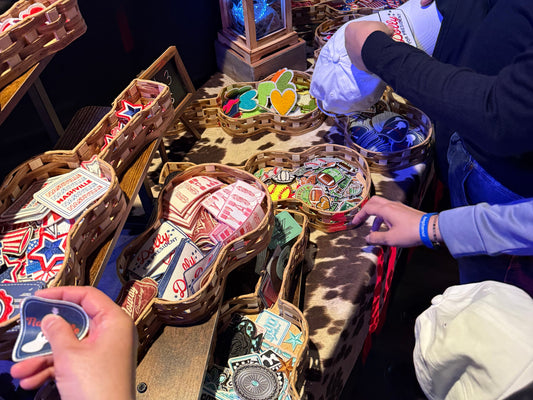Guests customizing trucker hats at an event in Nashville